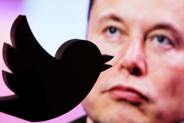 FILE PHOTO: Illustration shows Elon Musk photo and Twitter logo