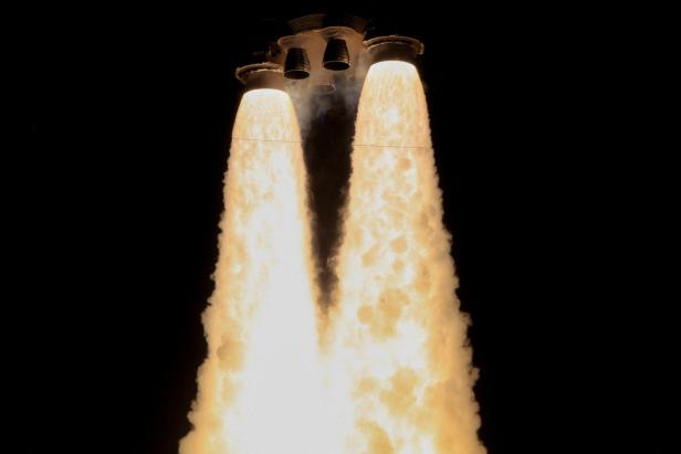 NASA's next-generation moon rocket, the Space Launch System (SLS) rocket with the Orion crew capsule, lifts off from launch complex 39-B on the Artemis I mission