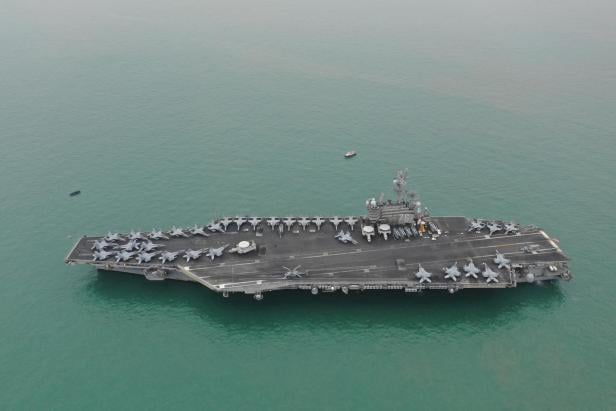 FILE PHOTO: FILE PHOTO: U.S. Navy aircraft carrier USS Ronald Reagan leaves Victoria Harbour after a visit to Hong Kong