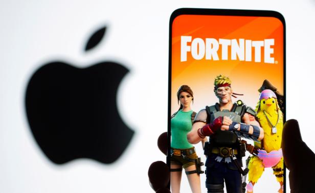 FILE PHOTO: Fortnite graphic and Apple logo displayed in illustration