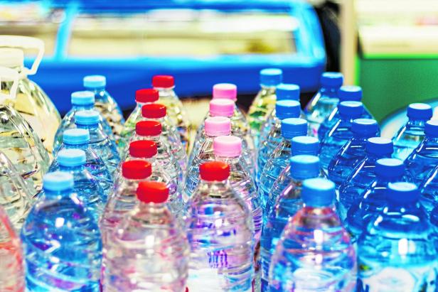 colorful caps on plastic bottles with water