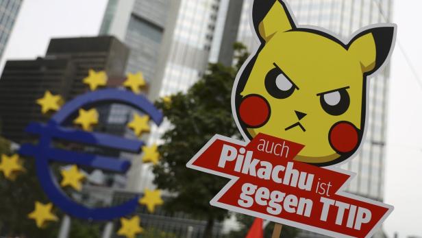 Consumer rights activists take part in a march to
