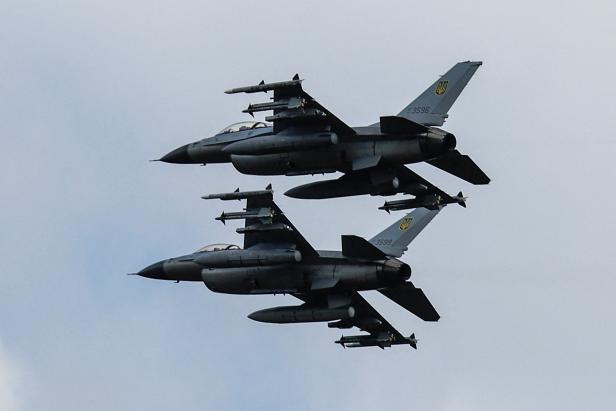 Ukrainian F-16 fighting aircrafts are seen in the air during marking the Day of the Ukrainian Air Forces in an undisclosed location in Ukraine