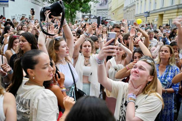 Fans gather after the government confirmed a planned attack at the venue of three Taylor Swift concerts, in Vienna