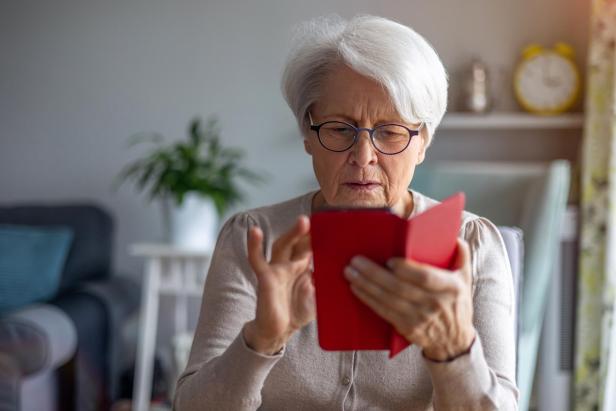 Portrait of senior woman using smartphone at home