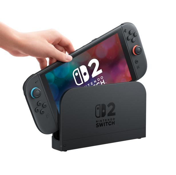 Eine Hand legt eine Nintendo Switch 2 in die Dockingstation.