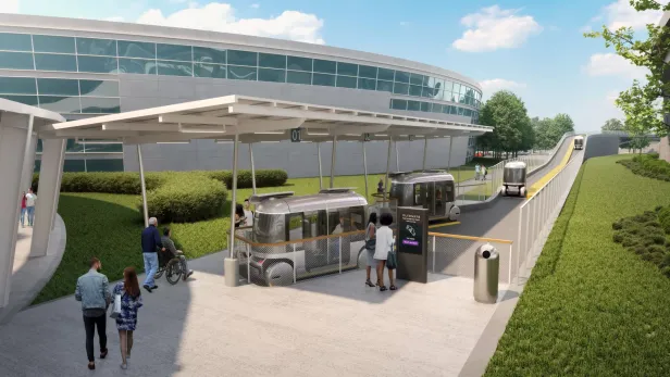 Menschen warten an einer modernen Haltestelle auf autonome Shuttle-Fahrzeuge.