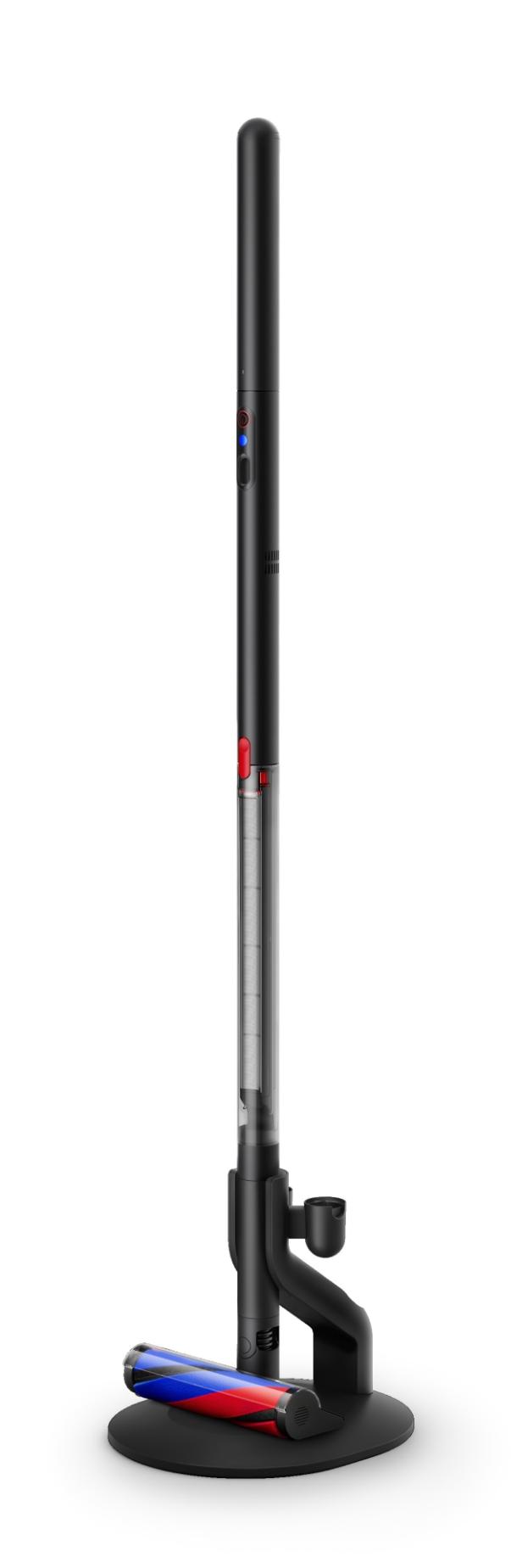 Schlanker, schwarzer Dyson PencilVac Akkustaubsauger auf runder Bodenladestation.