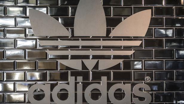 An Adidas logo is seen in a pop-up store in Berlin in this December 2, 2014 file photo. REUTERS/Hannibal Hanschke/Files