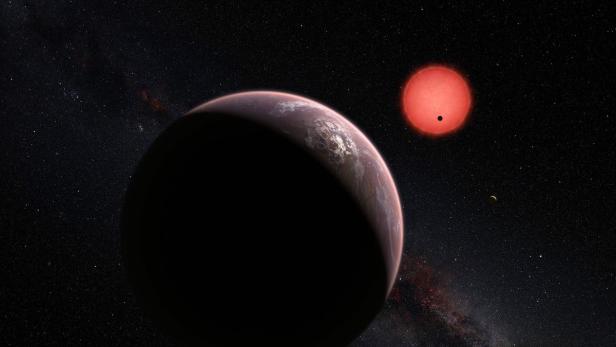 TO GO WITH AFP STORY BY LAURENCE COUSTAL An artistÕs impression released by the the European Southern Observatory (ESO) on May 2, 2016 shows an imagined view of one of the three planets orbiting an ultracool dwarf star just 40 light-years from Earth that were discovered using the TRAPPIST (&quot;TRAnsiting Planets and PlanetesImals Small Telescope&quot;) telescope at ESOÕs La Silla Observatory in Chile. These worlds have sizes and temperatures similar to those of Venus and Earth and are the best targets found so far for the search for life outside the Solar System. They are the first planets ever discovered around such a tiny and dim star. In this view one of the inner planets is seen in transit across the disc of its tiny and dim parent star. / AFP PHOTO / European Southern Observatory / - / RESTRICTED TO EDITORIAL USE - MANDATORY CREDIT &quot;AFP PHOTO / ESO &quot; - NO MARKETING NO ADVERTISING CAMPAIGNS - DISTRIBUTED AS A SERVICE TO CLIENTS