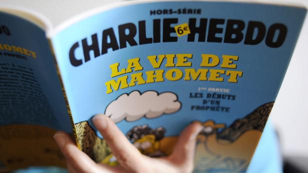 epa03522245 A special edition of the French satirical magazine Charlie Hebdo, in Paris, France, 02 January 2012. Reports state that Charlie Hebdo published, on 02 January 2012, with cartoons on the life of the Muslim prophet Mohammed, in Paris, France. The same magazine published cartoons of Mohammed in September 2012, prompting protests worldwide that forced the temporary closure of several French institutes abroad. EPA/YOAN VALAT