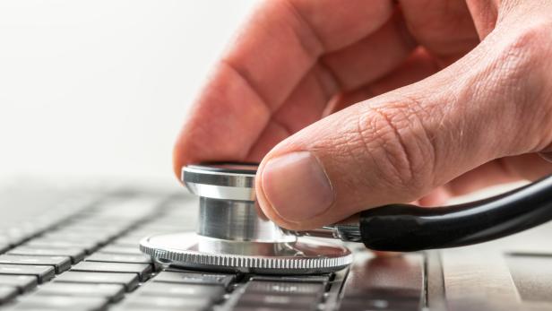 Man checking the health of his laptop computer