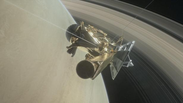 Illustration der NASA-Raumsonde Cassini über dem Saturn