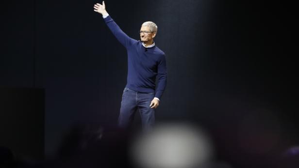 Tim Cook waves during Apple's annual developer conference in San Jose