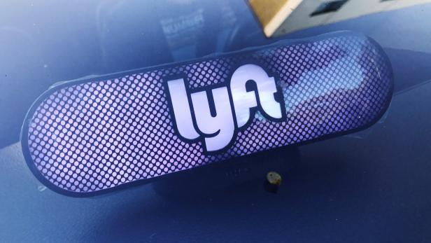 FILE PHOTO:    An illuminated sign appears in a Lyft ride-hailing car in Los Angeles
