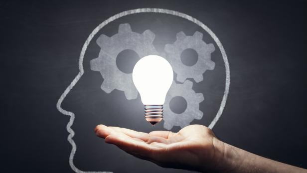 Inspiration - Light Bulb Hand Idea Blackboard