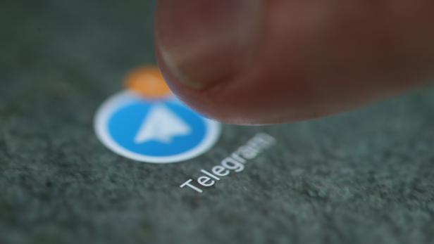 The Telegram app logo is seen on a smartphone in this illustration
