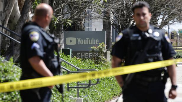 Police officers and crime scene tape are seen at Youtube headquarters following an active shooter situation in San Bruno, California