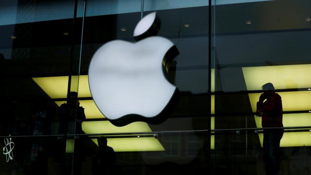 FILE PHOTO: Activists from the anti-globalisation organisation Attac protest against alleged tax evasion by Apple company in front of an Apple store in Frankfurt