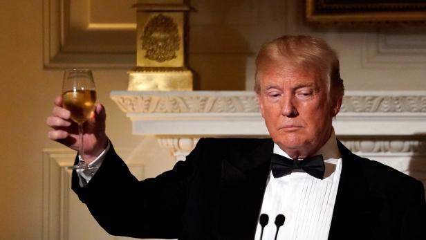 U.S. President Donald Trump toasts French President Emmanuel Macron (not pictured) during a State Dinner at the White House in Washington, U.S.