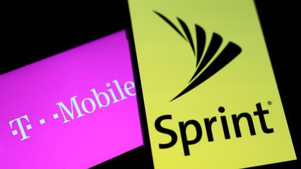 FILE PHOTO:    Smartphones with the logos of T-Mobile and Sprint are seen in this illustration