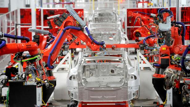 FILE PHOTO --  Robotic arms assemble Tesla's Model S sedans at the company's factory in Fremont,