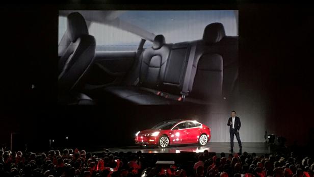 FILE PHOTO: Tesla Chief Executive Elon Musk introduces one of the first Model 3 cars in Fremont California