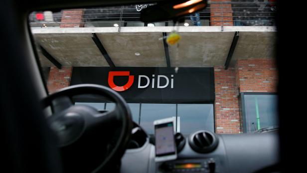The logo of Chinese ride-hailing firm Didi Chuxing is seen at their new drivers center in Toluca