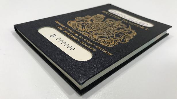 A handout photograph shows the original 'blue' British passport, which was subsequently replaced by the burgundy EU British passport, supplied by the UK government in London,