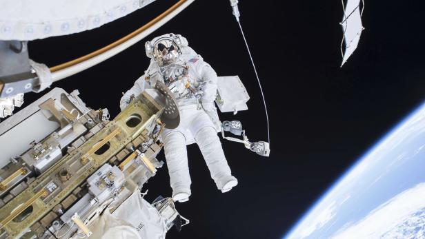 Expedition 46 Flight Engineer Tim Kopra performs a spacewalk outside the International Space Station in this NASA handout photo