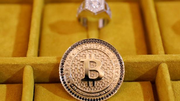 Jewelry with the Bitcoin logo is seen on display at the Consensus 2018 blockchain technology conference in New York City,