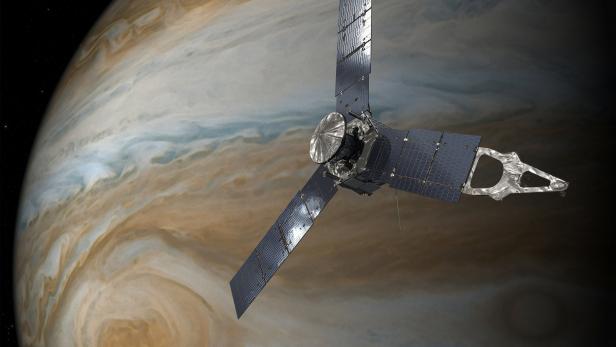 NASA handout of an illustration depicting the U.S. space agency's Juno spacecraft in orbit above Jupiter's Gread Red Spot.
