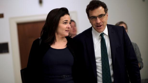 Facebook Chief Operating Officer Sheryl Sandberg and Vice President of global communications and public policy Elliot Schrage on Capitol Hill after meeting with U.S. Rep. Jackie Speier (D-CA) in Washington