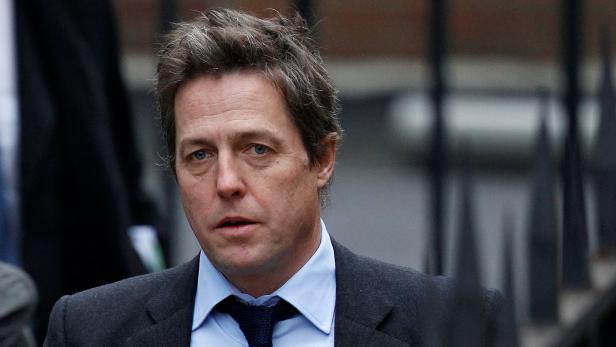 FILE PHOTO: British actor Hugh Grant arrives at the Leveson Inquiry at the High Court in central London