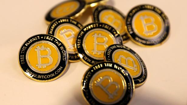 Bitcoin.com buttons are seen displayed on the floor of the Consensus 2018 blockchain technology conference in New York City