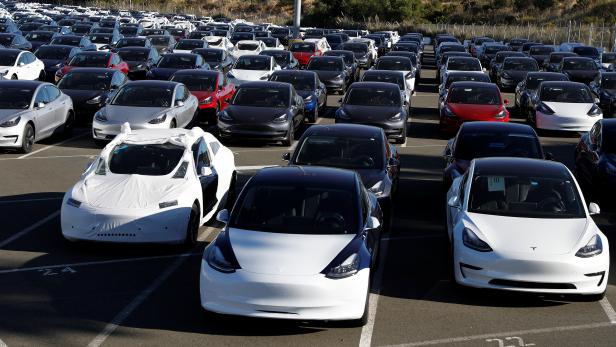 A parking lot of predominantly new Tesla Model 3 electric vehicles is seen in Richmond