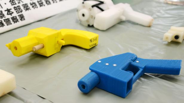Seized plastic handguns which were created using 3D printing technology are displayed at Kanagawa police station in Yokohama, south of Tokyo