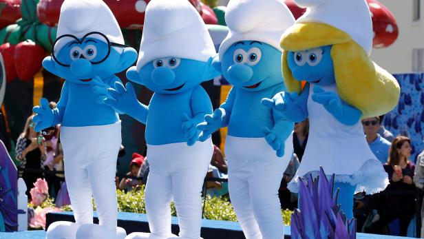 Smurf characters dance at the premiere of the film "Smurfs: The Lost Village" in Culver City, California