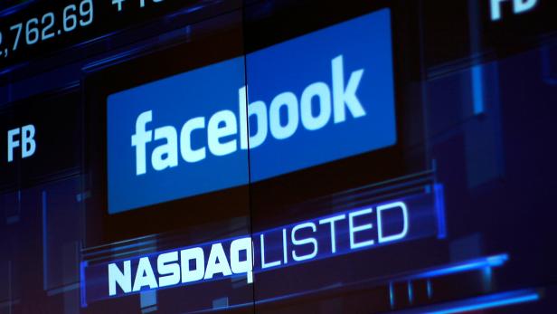 FILE PHOTO: Monitors displays the Facebook, Inc. stock during morning trading at the NASDAQ Marketsite in New York