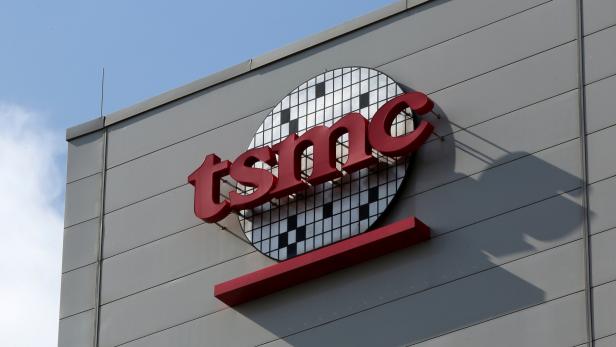 A logo of Taiwan Semiconductor Manufacturing Co (TSMC) is seen on a wall of its headquarters in Hsinchu
