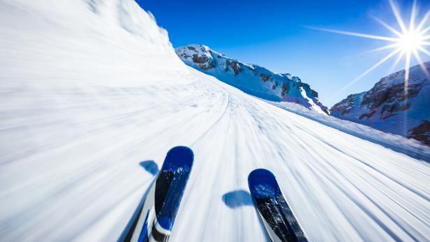 Alpine downhill skiing on sunny day