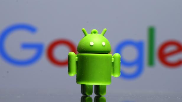 FILE PHOTO - A 3D printed Android mascot Bugdroid is seen in front of a Google logo in this illustration