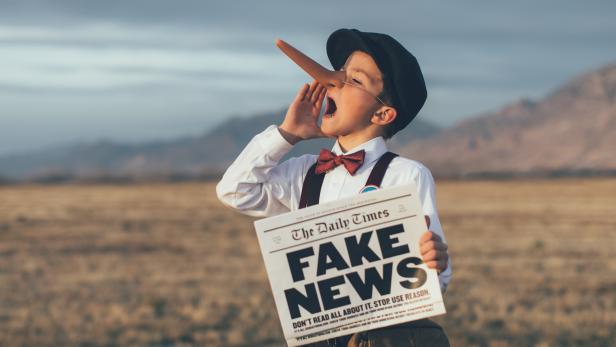 Old Fashioned Pinocchio News Boy Holding Fake Newspaper