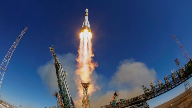 FILE PHOTO: The Soyuz MS-10 spacecraft carrying the crew of astronaut Nick Hague of the U.S. and cosmonaut Alexey Ovchinin of Russia blasts off to the International Space Station (ISS) from the launchpad at the Baikonur Cosmodrome