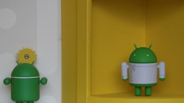 Android toys are displayed at one of its booths at the Mobile World Congress in Barcelona