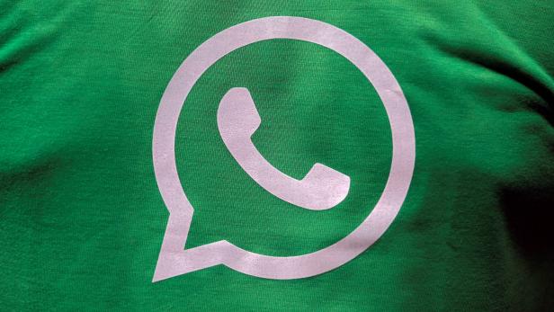 A logo of WhatsApp is pictured on a T-shirt worn by a WhatsApp-Reliance Jio representative during a drive by the two companies to educate users, on the outskirts of Kolkata