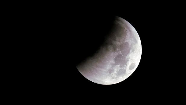 The moon is seen during a lunar eclipse over Shanghai