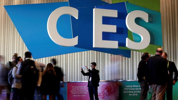 FILE PHOTO: Man takes a selfie in front of the CES logo during the 2018 CES in Las Vegas
