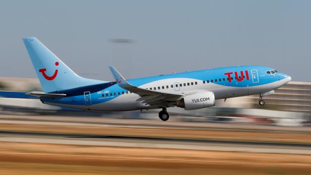 FILE PHOTO: A TUI fly Belgium Boeing 737 airplane takes off from the airport in Palma de Mallorca