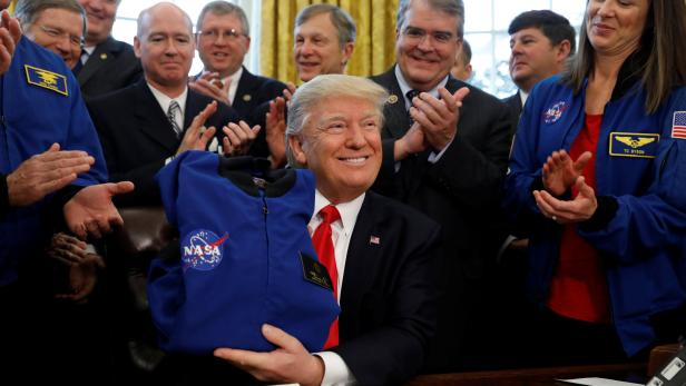 Trump signs NASA act at the White House in Washington